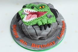 dinosaur face birthday cake